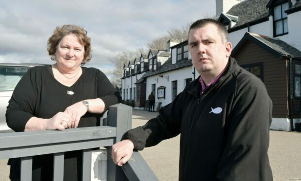 Judy Fish and Mark Carrington standing outside the Applecross Inn.