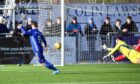 Mitch Megginson tucks away his second and Cove Rangers' third against Peterhead. Pictures by Duncan Brown