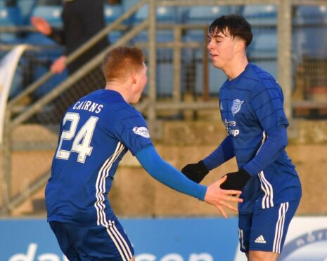 Grant Savoury celebrates with Peterhead team-mate Owen Cairns