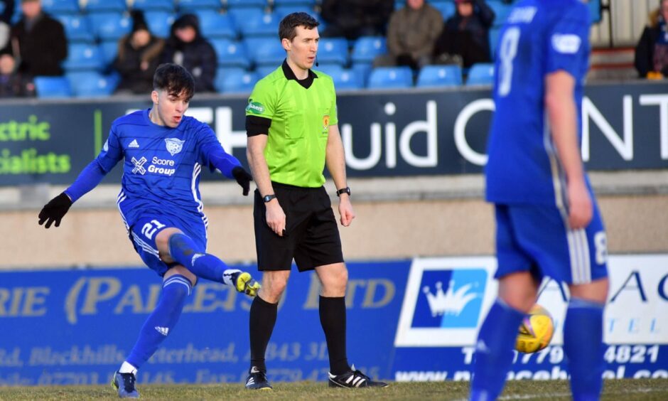Peterhead midfielder Grant Savoury shoots for goal against Montrose