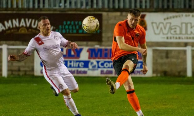 Ryan McRitchie clears for Rothes.