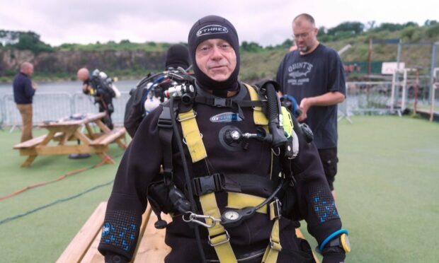 Ross Kemp in a diving outfit.