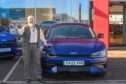 Simon Barrett with his new Kia EV6 - which he hopes to drive after waiting months for the DVLA to give him his licence back. Picture: Scott Baxter