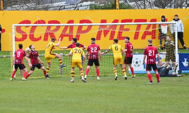 Allan Macphee (17) scores for Forres and celebrates. Picture by Scott Baxter