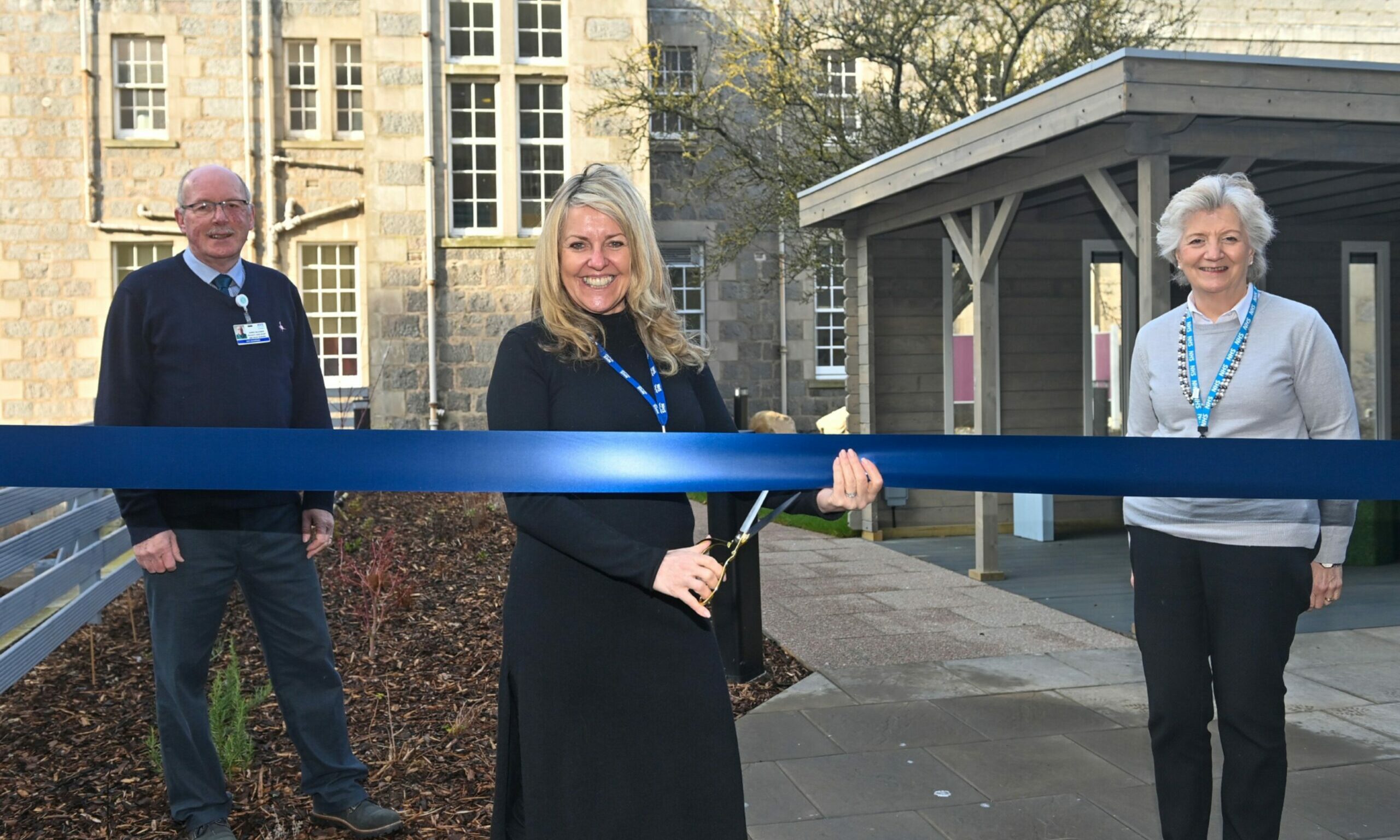 Rev James Falconer, Lisa Duthie and Sheena Lonchay cut the ribbon of the new staff garden on Wednesday.

 Picture by Scott Baxter 09/03/2022