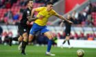 Sunderland's Ross Stewart and Crewe's Luke Offord battle for the ball