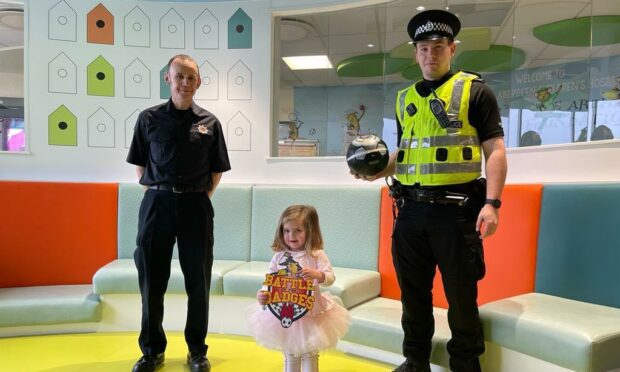 Firefighter Neil Barnett, PC Ryan Rozanski and Holly Shepherd at the Royal Aberdeen Children's Hospital.