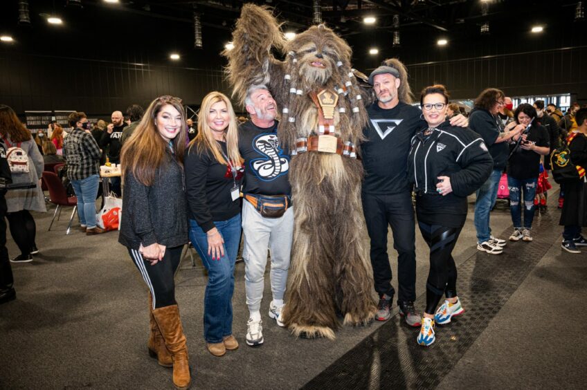 The group pose with Chewbacca in the middle at comic con aberdeen