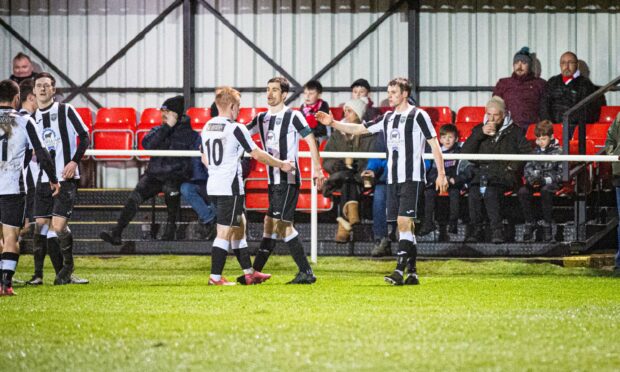 Ryan Sargent, right, celebrates after scoring Fraserburgh's second goal. Picture by Wullie Marr