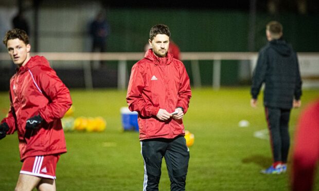 Formartine United manager Stuart Anderson, centre, is pleased to have signed Matthew McLean