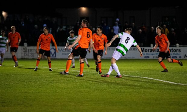 Kyle MacLeod, right, scores Buckie's equaliser against Rothes
