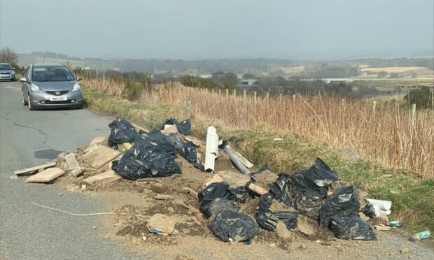 Aberdeen City Council have condemned 'dangerous fly-tippers' after they dumped waste in the middle of a busy Aberdeen road.