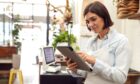 woman in restaurant using business internet