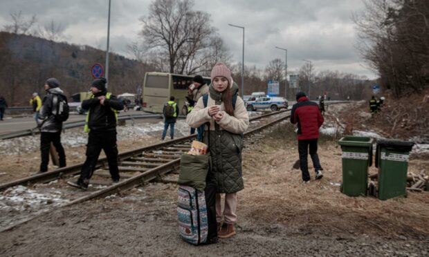 A young girl fleeing Ukraine, at the border in Kroscienko, Poland (Photo: Enrico Mattia Del Punta/NurPhoto/Shutterstock)