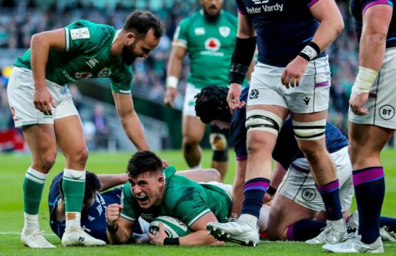 Dan Sheehan scores Ireland's first try against Scotland.