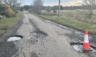 A main road from Tain to Fearn/Balintore has two deep potholes.