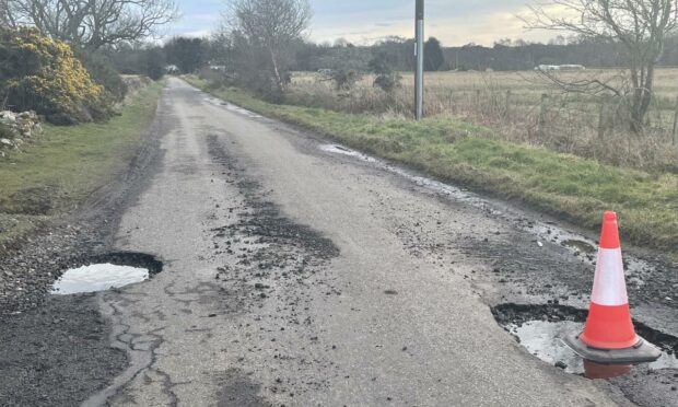 A main road from Tain to Fearn/Balintore has two deep potholes.