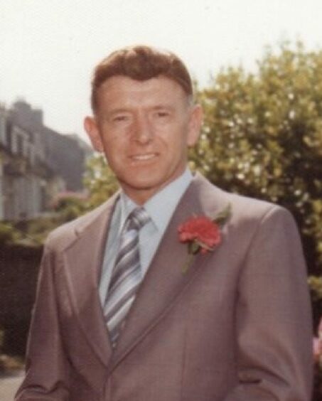 George Murdoch in a suit