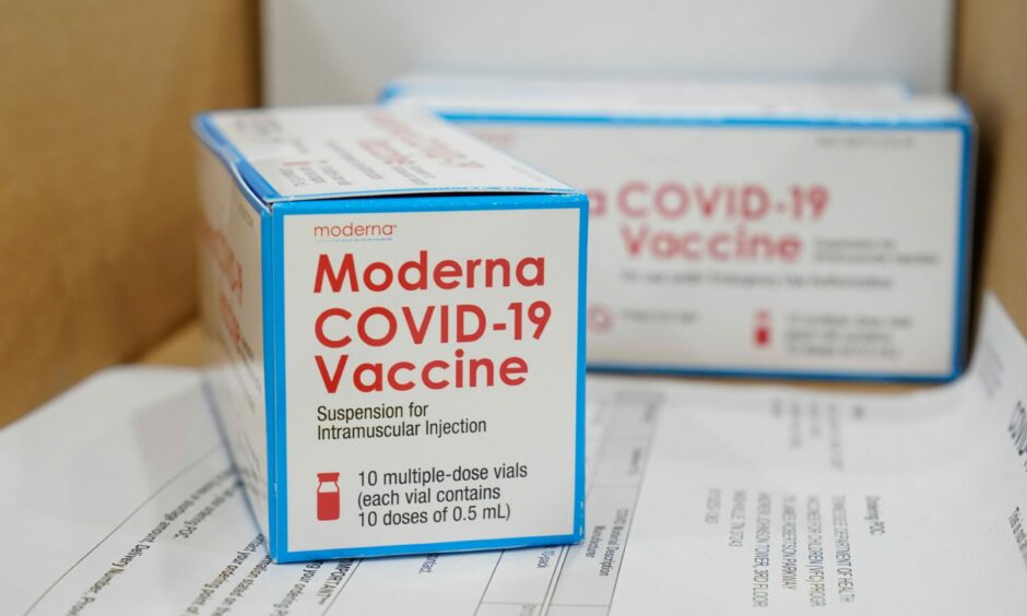 Boxes containing the Moderna COVID-19 vaccine sit in a packing box to be shipped from the McKesson distribution centre