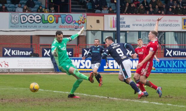 Danny Mullen of Dundee scores an equaliser to level at 2-2 against Aberdeen.