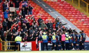 Ross County fans celebrate with the players after they sealed a top six finish in 2022. Image: Shutterstock.