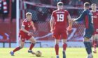 Aberdeen's Connor Barron with the ball during Saturday's loss to Ross County.