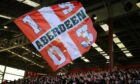 Aberdeen supporters at Pittodrie. Image: Shutterstcok