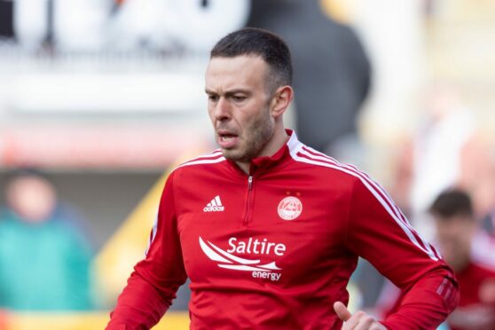 Aberdeen's Andrew Considine warming up ahead of the Ross County game. He was an unused substitute in the 1-0 loss.