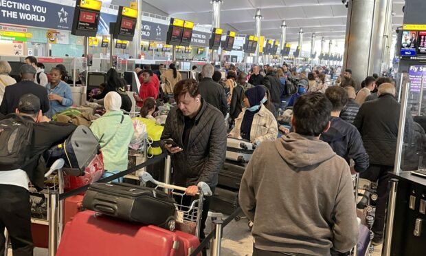 Queues build up at the check-in desks at London Heathrow.