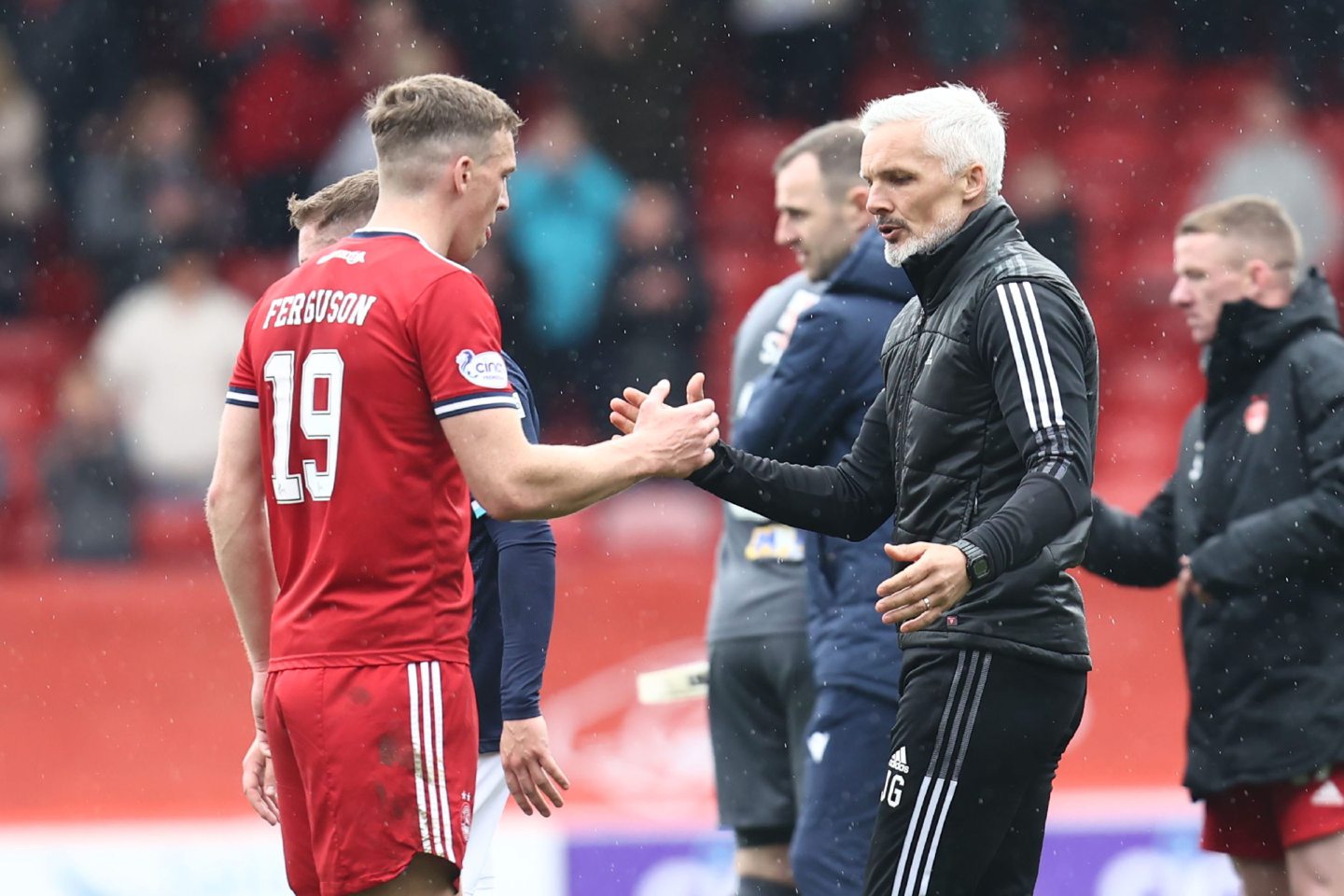 Aberdeen manager Jim Goodwin and scorer Lewis Ferguson shake hands