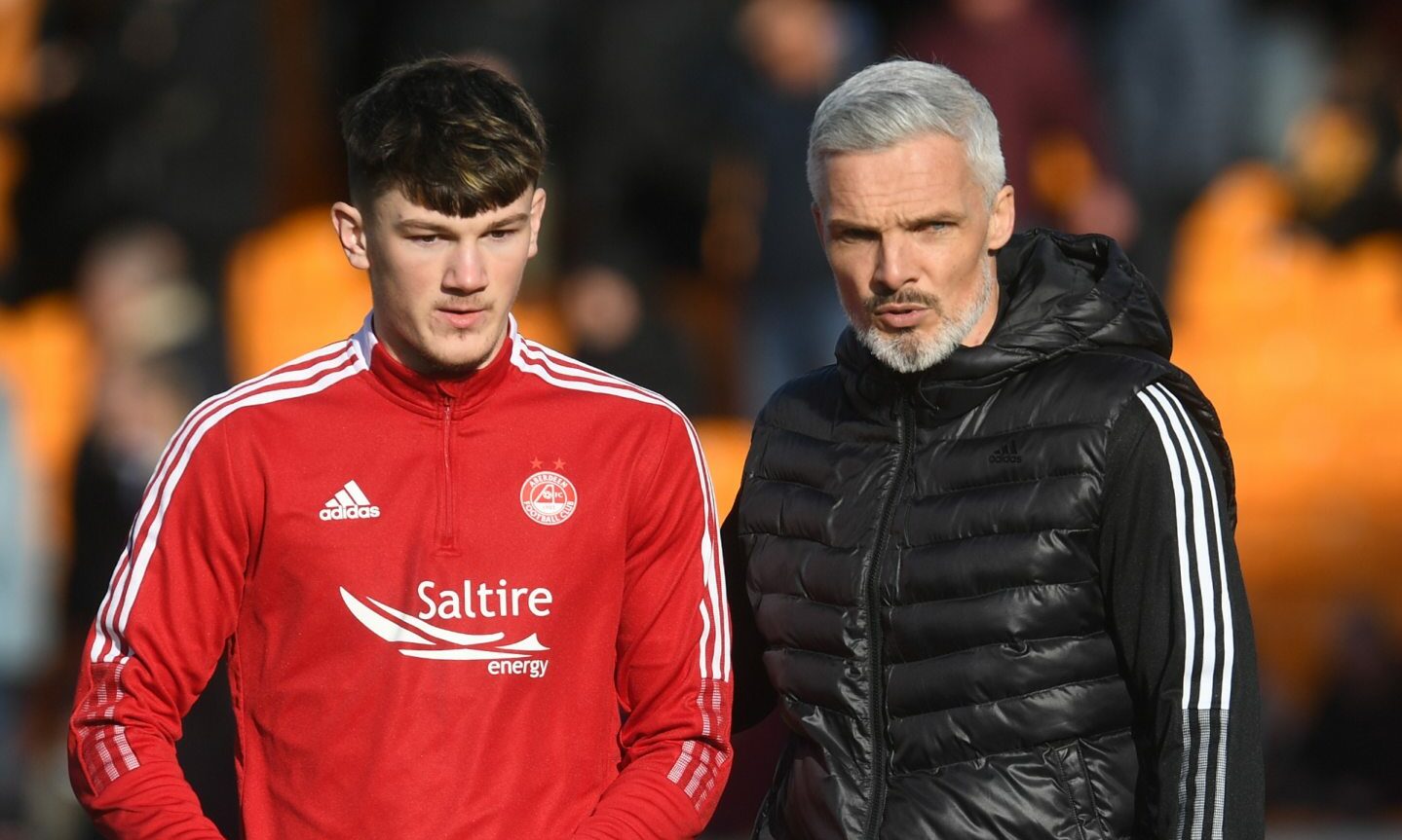 Former Aberdeen youth player and now first team player Calvin Ramsay with dons boss Jim Goodwin.