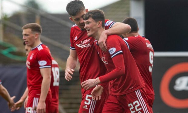Calvin Ramsay celebrates his first goal for the Dons with Declan Gallagher on Saturday