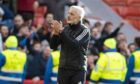 Aberdeen Manager Jim Goodwin applauds the supporters during the 1-0 loss to Ross County.