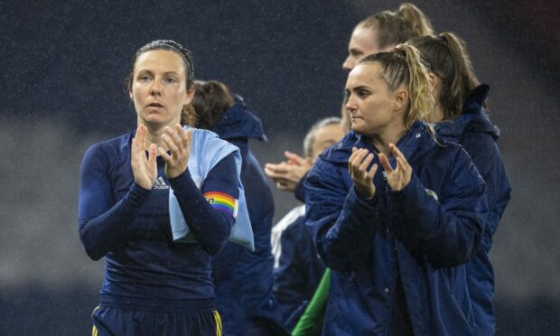 Rachel Corsie (left) and Sam Kerr applaud the fans at full time after Scotland's 2-0 defeat to Spain. (Photo by Ross MacDonald / SNS Group)