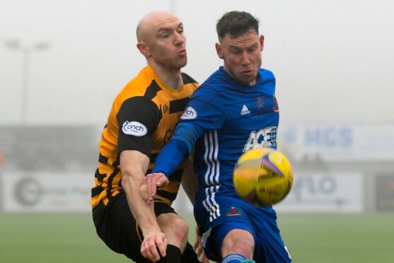 Cove Rangers skipper Mitch Megginson battles with Conor Sammon