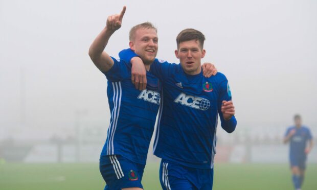 Cove Rangers defender Harry Milne celebrates his goal against Alloa with Jamie Masson