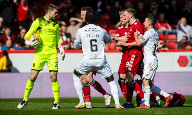 Aberdeen's Lewis Ferguson clashes with Max Stryjek.