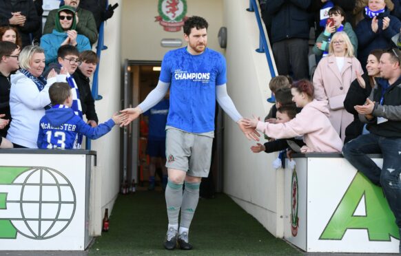 Cove Rangers goalkeeper Stuart McKenzie greets the fans after the win over Dumbarton