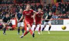 Lewis Ferguson scores from the penalty spot to make it 1-0 against Dundee.