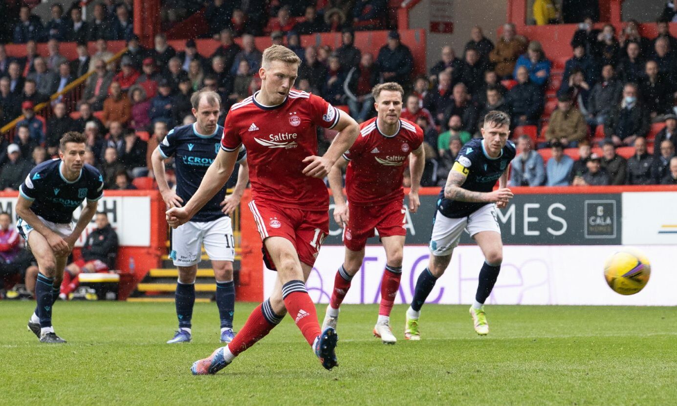 Lewis Ferguson scores from the penalty spot.