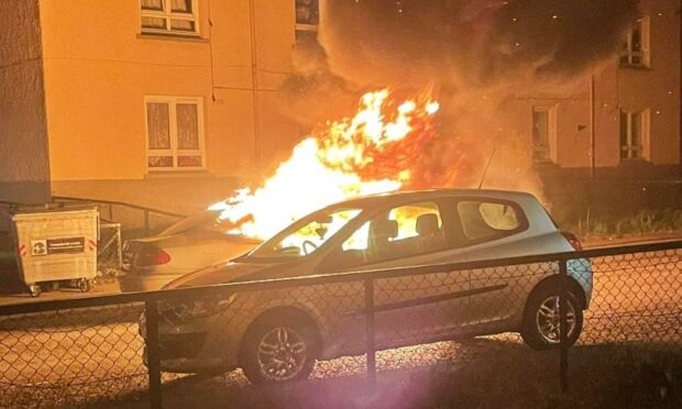 Car on fire in Lossie Place. Picture by Michelle Garrow
