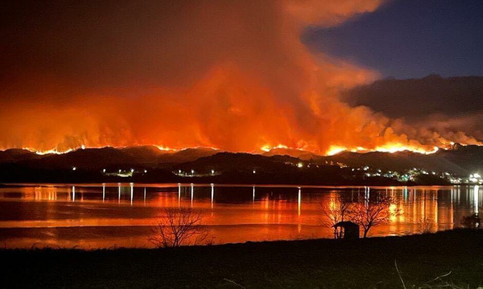 Wildfire near Kyle of Lochalsh lights up the sky in the night.