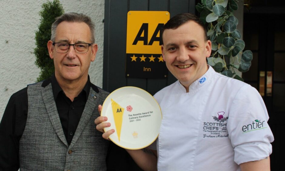 Newmachar chef holding AA Rosette award.