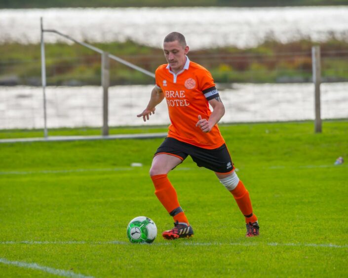 John Pirie playing football