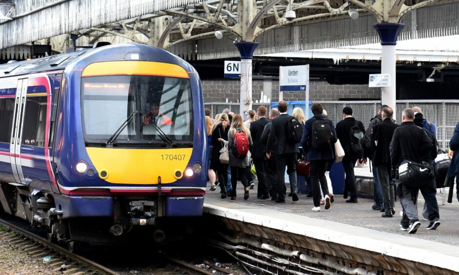 Commuters boarding a train at Aberdeen station. Picture by Kenny Elrick
