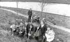 1993 - Torry Academy pupils, who were set to keep the riverbanks clean and green, pictured with police and council officers.