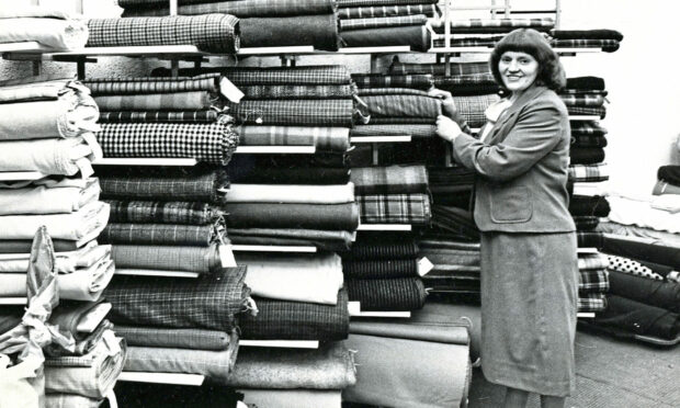 1979 - Piles of textiles tower high at Bracken Fabrics’ Aberdeen branch on Union Street.