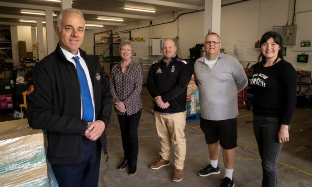 Aberdeen Harbour has donated £30k to the four charities. Picture shows; Bob Sanguinetti, Fiona Rae, Mark Williams, Gary Aitkenhead, and Lorna Carruthers at Cfine. Supplied by Newsline.