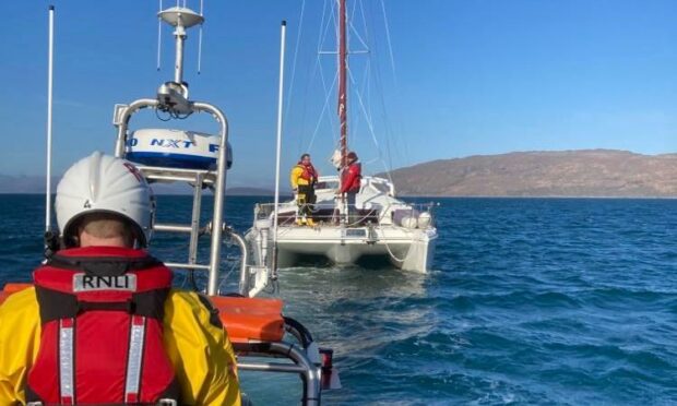 Kyle RNLI were called to aid a catamaran aground on rocks near Plockton. Picture by Kyle RNLI.