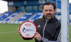 Paul Hartley after being presented with the Glen's League One Manager of the Month award for March 2022.